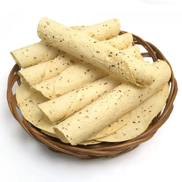 Rolled udad papad with black pepper in a woven basket